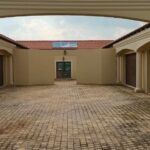 Multiple garage doors at an apartment complex installed by Expert Garage Doors.