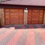 Two residential garage doors installed by Expert Garage Doors.