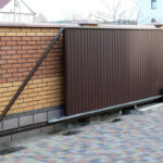 Brown gate installed by Expert Garage Doors.