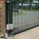 Black gate with motor automation installed by Expert Garage Doors.