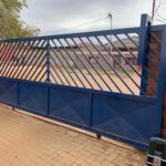 Blue gate with motor automation installed by Expert Garage Doors.