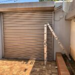 Roller shutter doors installed in a residential garage by Expert Garage Doors.