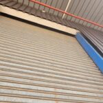 Residential garage roller shutter doors installed by Expert Garage Doors.