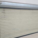 Indoor view of roller shutter doors installed by Expert Garage Doors.