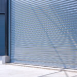 Close-up view of roller shutter doors installed by Expert Garage Doors.