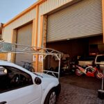 Roller shutter doors for warehouse entry, installed by Expert Garage Doors.