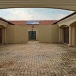 Multiple garage doors at an apartment complex installed by Expert Garage Doors.