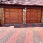 Two residential garage doors installed by Expert Garage Doors.