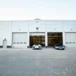 Commercial garage doors at a car dealership installed by Expert Garage Doors.