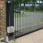 Black gate with motor automation installed by Expert Garage Doors.
