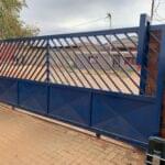 Blue gate with motor automation installed by Expert Garage Doors.