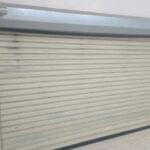 Indoor view of roller shutter doors installed by Expert Garage Doors.